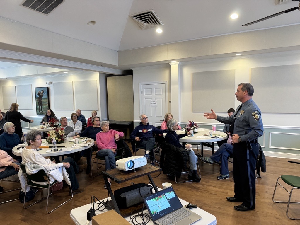 Sheriff DeWees speaking in front of a class